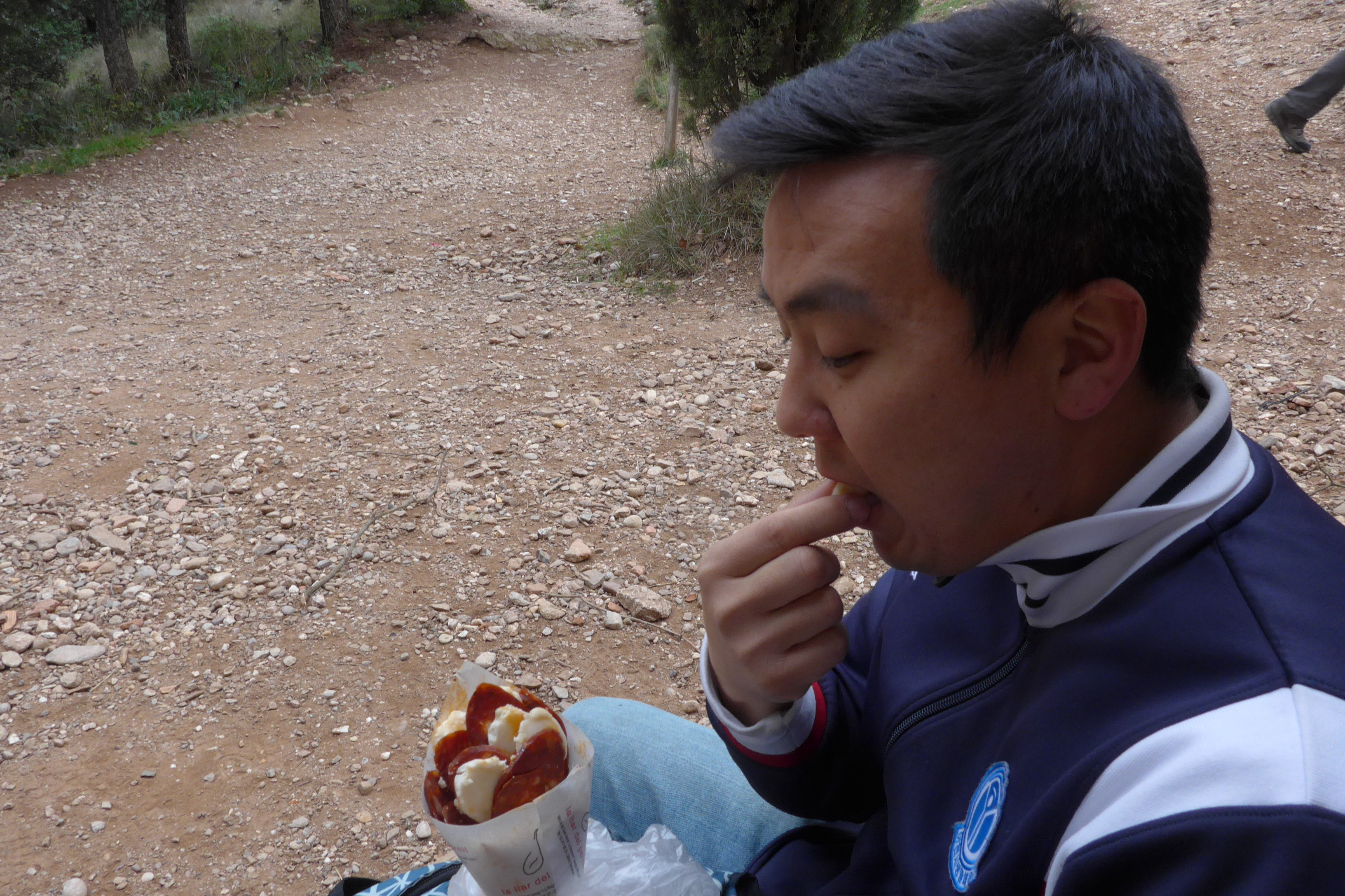 Snacking on chorizo and queso hiking Montserrat