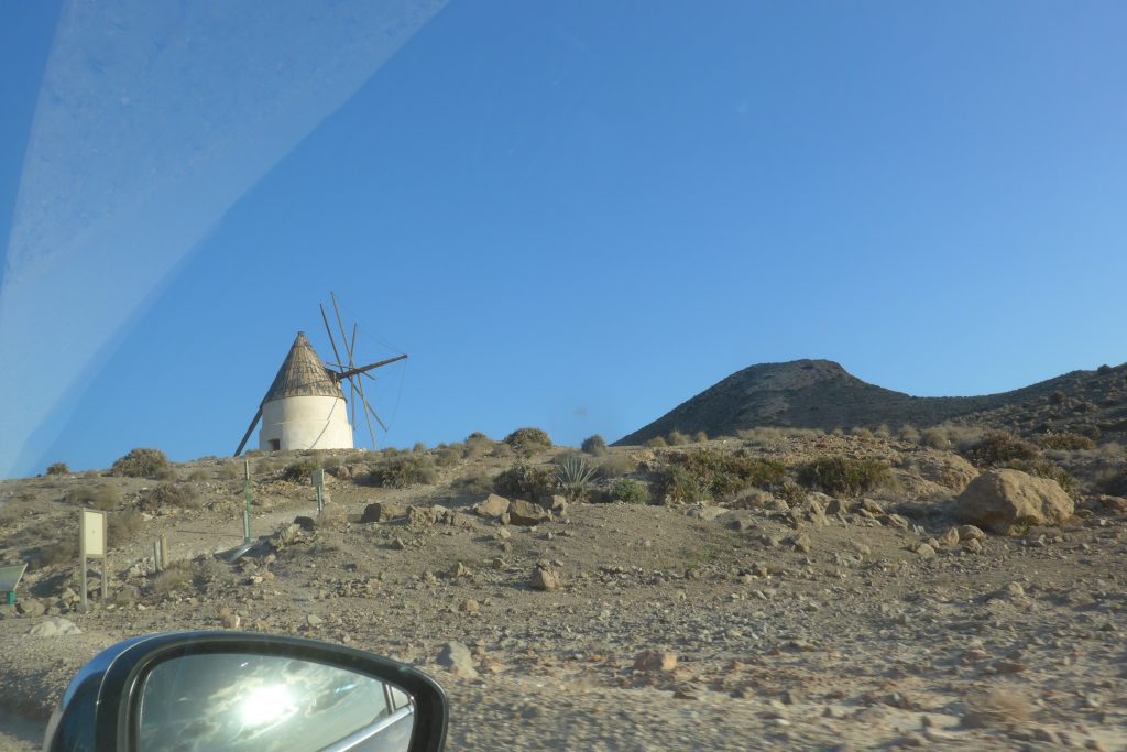 Driving past the windmills on the way to The rock that appeared in Indiana Jones movie, shot here at Playa Monsul in San Jose, Spain