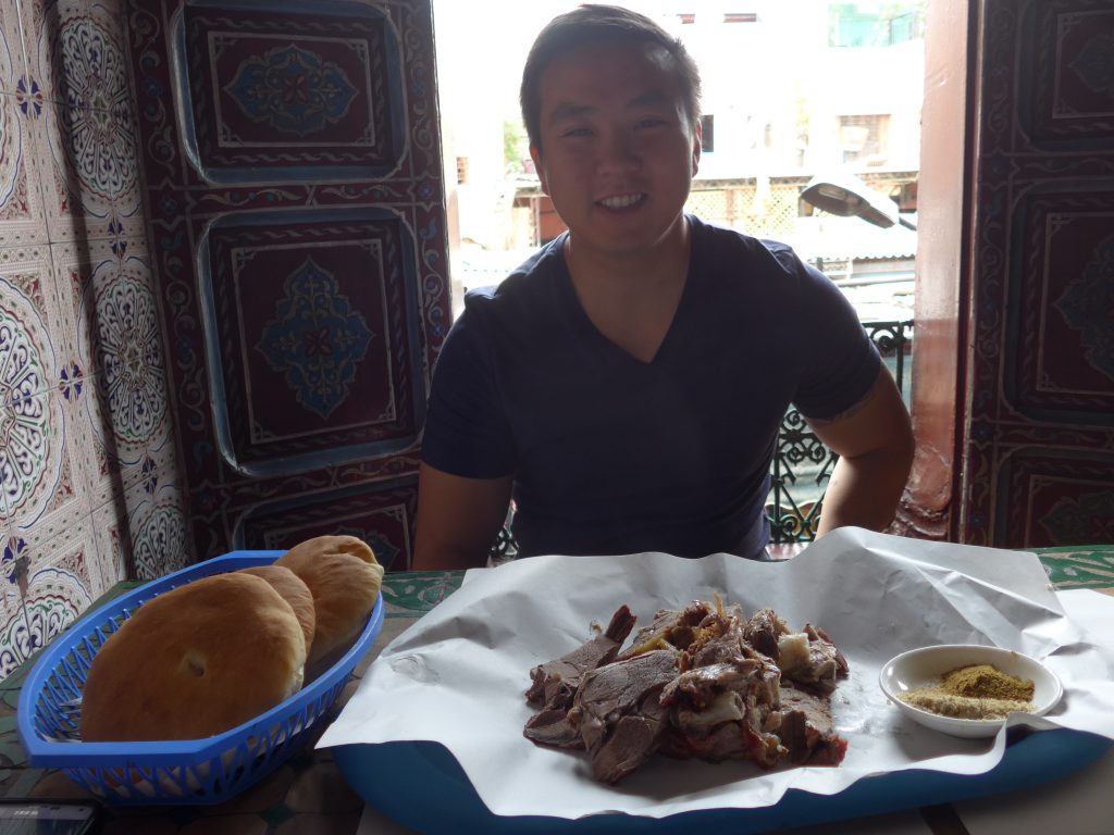 Enjoying mechoui (roast lamb) in Marrakesh
