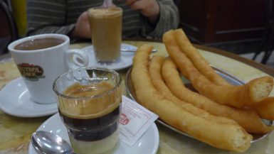 A guide to the best churrerias to indulge in around Spain! If you are looking for a must-try food in Spain, you have to try the churros con chocolate! This popular, indulgent breakfast treat is a must when visiting.