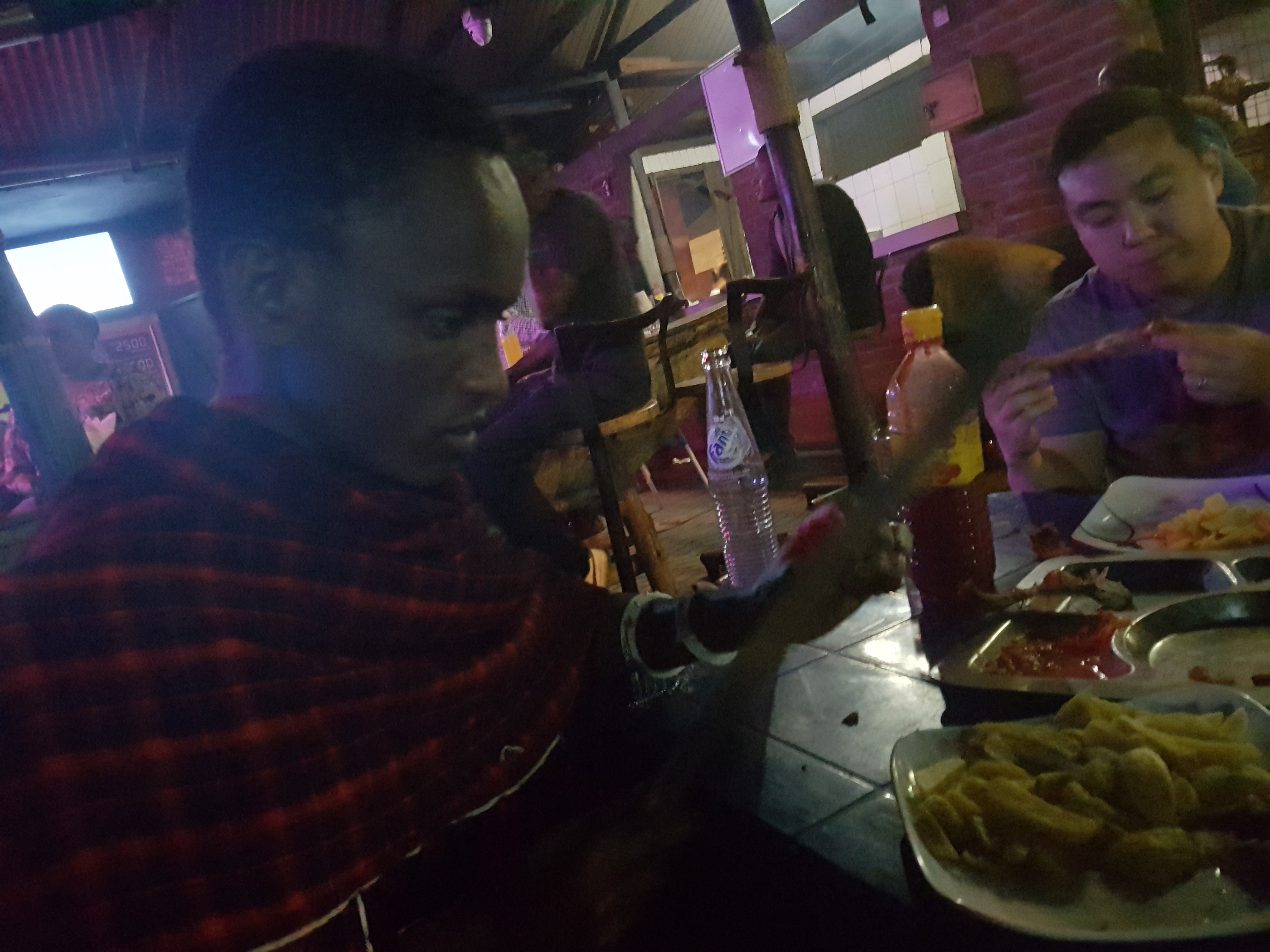 Papa King cutting meat with his machete