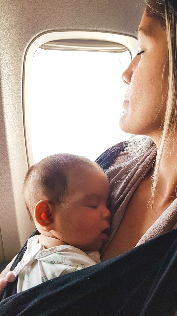 Babywearing on flight with 4 month old