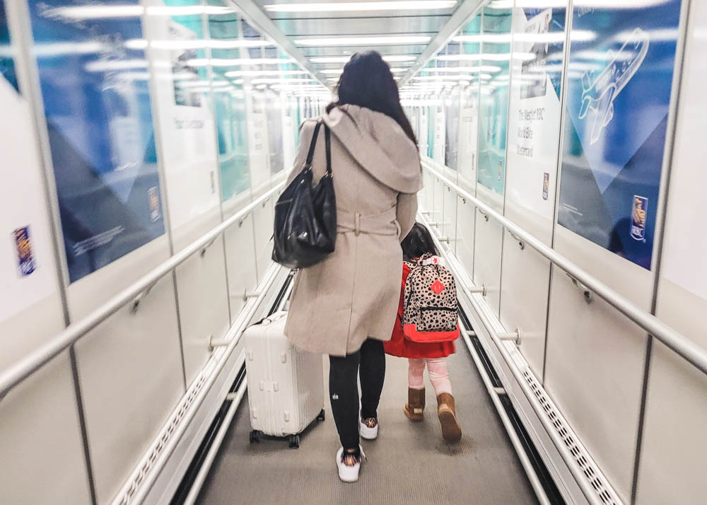 Boarding plane with 3 year old