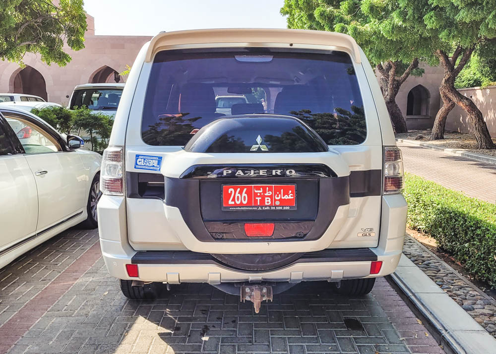 Driving in Oman Red License Plate