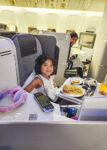 Flying business class with kids - worth it? Our honest experience after 4 long-haul flights, plus the pros, cons and one unexpected downside.
