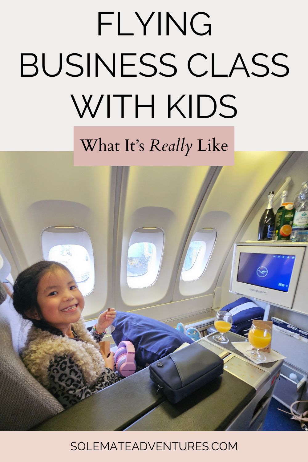 Flying business class with kids - worth it? Our honest experience after 4 long-haul flights, plus the pros, cons and one unexpected downside.